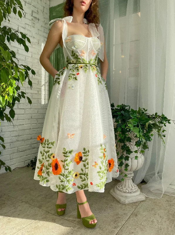 Mini dresses with tassel accents for a fun touch Butterfly Blossom Dress