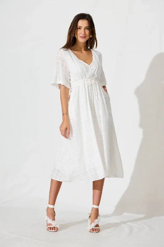 Midi dresses with ruffled hems for a romantic date nightKersey Midi Dress In White Cotton