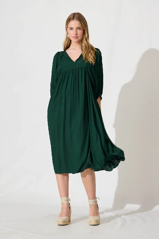 Midi dresses with pleated bodices for a classic and tailored lookSpring Afternoon Midi Smock Dress In Emerald