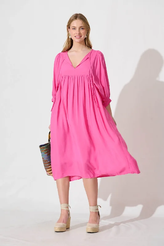 Midi dresses with tiered skirts for a bohemian festival lookSpring Afternoon Midi Smock Dress In Hot Pink